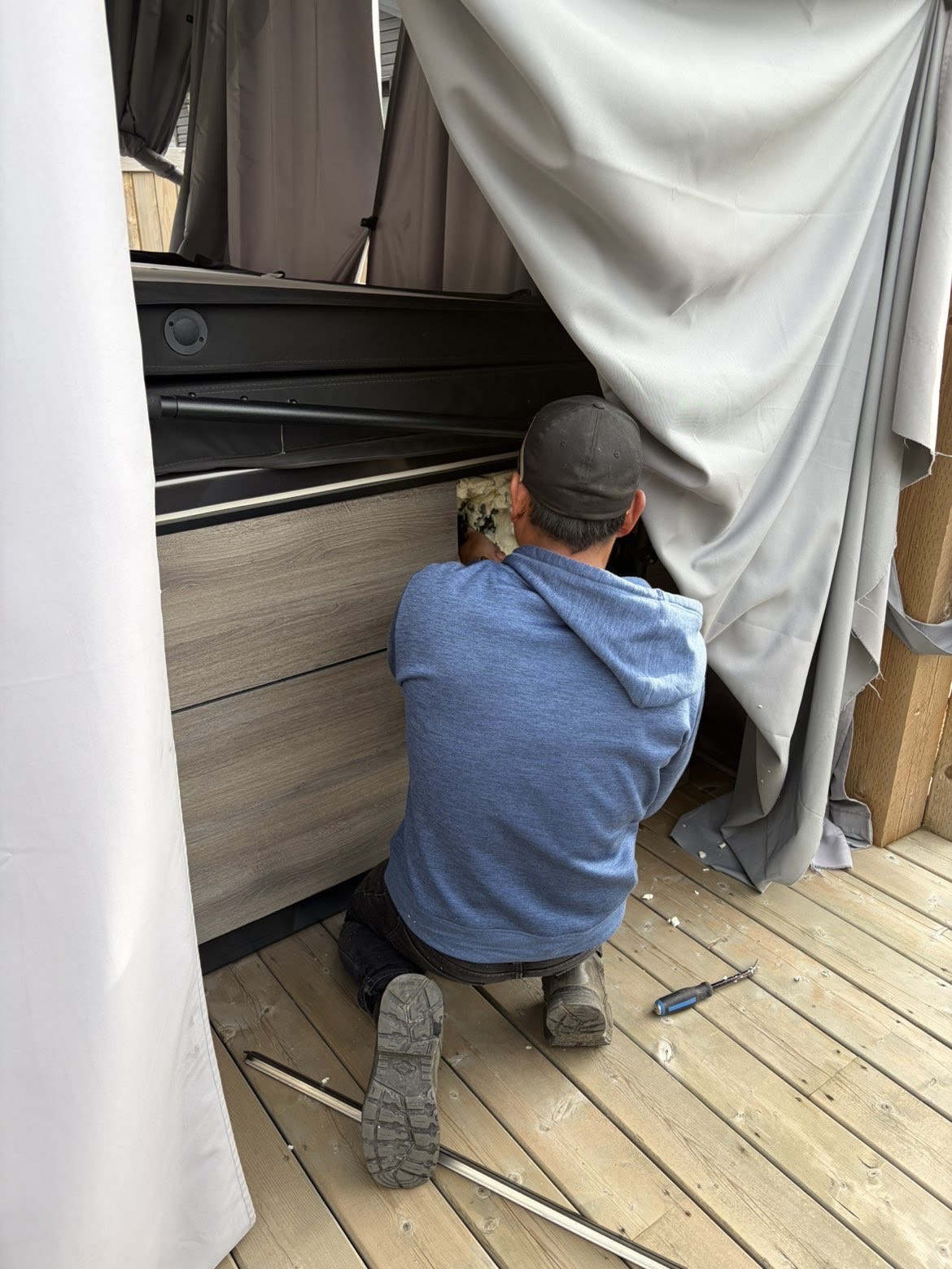 Certified technician servicing a Bullfrog hot tub